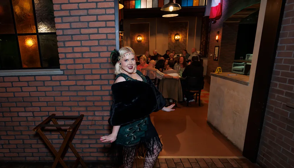 A person in vintage-style attire poses joyfully in front of a restaurant filled with people dining