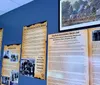 The image showcases a collage of the Hatfield  McCoy Experience museum featuring historical displays artifacts and promotional materials highlighting the infamous family feud