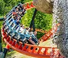 The image advertises the Smoky Mountain Summer Celebration at Dollywood highlighting various attractions and a new ride Night Flight Expedition launching in 2026