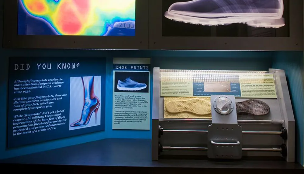 The image shows an educational display about shoe prints including information panels sample footgear impressions and images related to forensic analysis