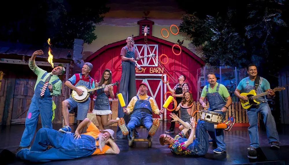 A lively group of performers engages in various entertaining activities such as playing instruments juggling and comedy in a barn-themed stage setting