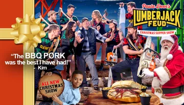 The image depicts a lively and colorful promotional scene for Paula Deen's Lumberjack Feud Christmas Supper Show, featuring a playful group of people dressed as lumberjacks, along with a child in the foreground and a character dressed as Santa Claus holding a chainsaw.