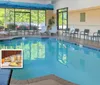The image features an indoor pool area with seating highlighting amenities such as free hot breakfast and premium WiFi located on the Parkway