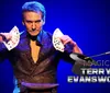 A magician is shown confidently displaying a fan of playing cards on a promotional poster for a magic show at The Grand Majestic Theater