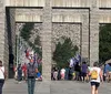 Three children are gazing at the monumental sculpture of four US presidents carved into Mount Rushmore