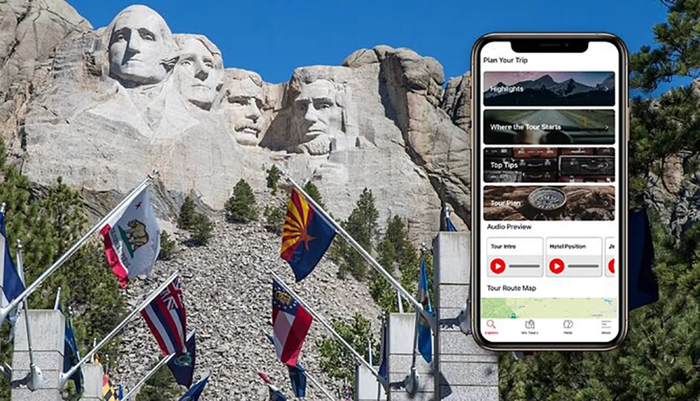 The image shows the iconic Mount Rushmore National Memorial with the heads of four US presidents carved into the granite alongside a mobile phone displaying a tour app interface suggesting a modern way to explore this historic site