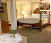 The image shows a luxurious hotel room with a four-poster bed wooden furniture and a bathroom highlighting amenities like a spa room service and a balcony bar and restaurant