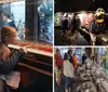 Visitors are engaged in examining a ship model and reading information on display at a maritime museum exhibit