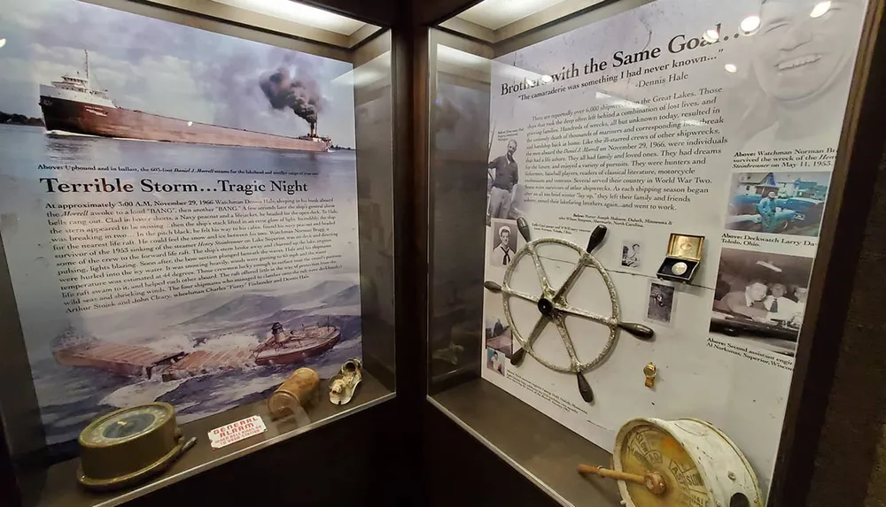 The image shows a museum display dedicated to a maritime disaster with information panels a ships wheel and nautical artifacts
