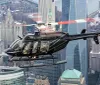 A helicopter is flying over a dense urban landscape with skyscrapers and a bridge in the background