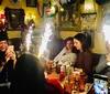 A group of happy people are enjoying drinks together in a cozy lounge with stylish decor