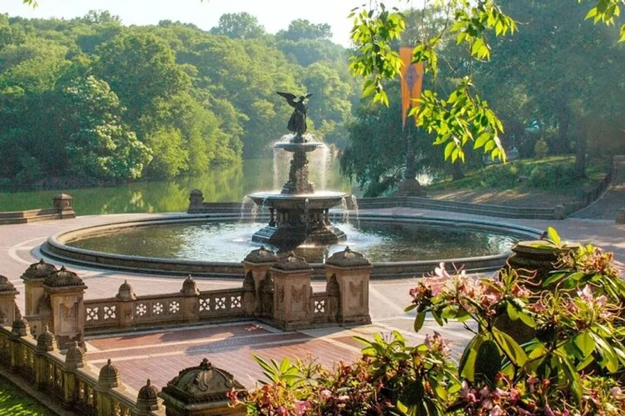 The image shows an ornate fountain surrounded by lush greenery and benches, with the early morning sunlight casting a warm glow over the serene setting.