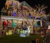 A house is extravagantly adorned with a vibrant display of Christmas lights featuring wreaths garlands and festive decorations covering the entire faade