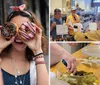 A person is playfully holding up two colorful doughnuts to their eyes like glasses while another person takes their photo with a smartphone