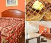 The image shows a hotel room with a brightly patterned bedspread warm orange walls and basic furnishings including a work desk chair and nightstands