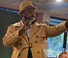 A group of people dressed in 1920s-style attire are enjoying a dinner show with text praising the performance and service and an inset image of pasta