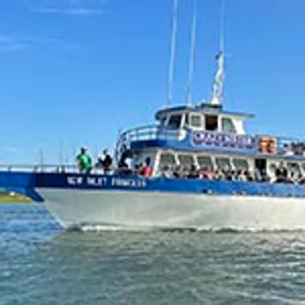 The image shows a large white and blue passenger boat named New Jersey Princess cruising on a body of water under a clear blue sky