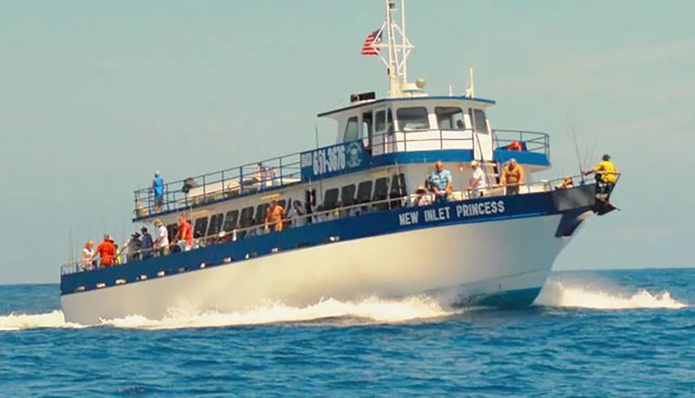 A boat named NEW INLET PRINCESS is advertised with a promise of guaranteed dolphin sightings for passengers on board
