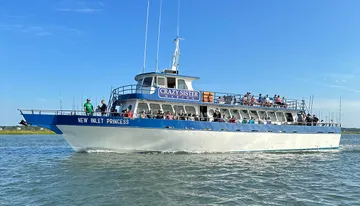 The image shows a large boat named 
