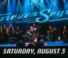 A band performs on stage under a large lit sign that says Forever Seger - The Silver Bullet Experience with a date of Saturday August 3 indicated below