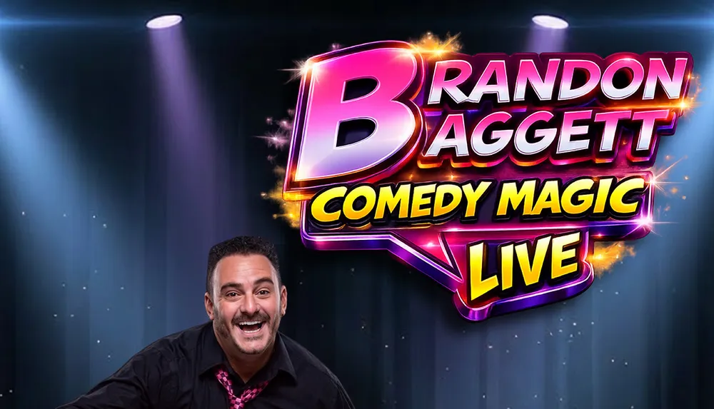 A smiling man stands in front of a vibrant illuminated sign featuring the title Brandon Baggett Comedy Magic Live