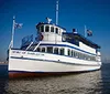 The image shows a boat named Spirit of Charleston with a list of Charleston attractions including the Historic District Harbor City Market Boone Hall Plantation and Patriots Point Naval Museum alongside a small inset of the City Market and a box lunch