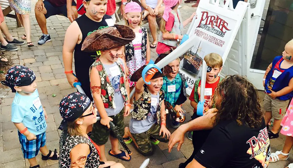 A group of children excitedly dressed as pirates are engaging in a playful activity or an event called Pirate Adventures