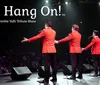 Four performers in red jackets are entertaining an audience on stage during a Frankie Valli tribute show