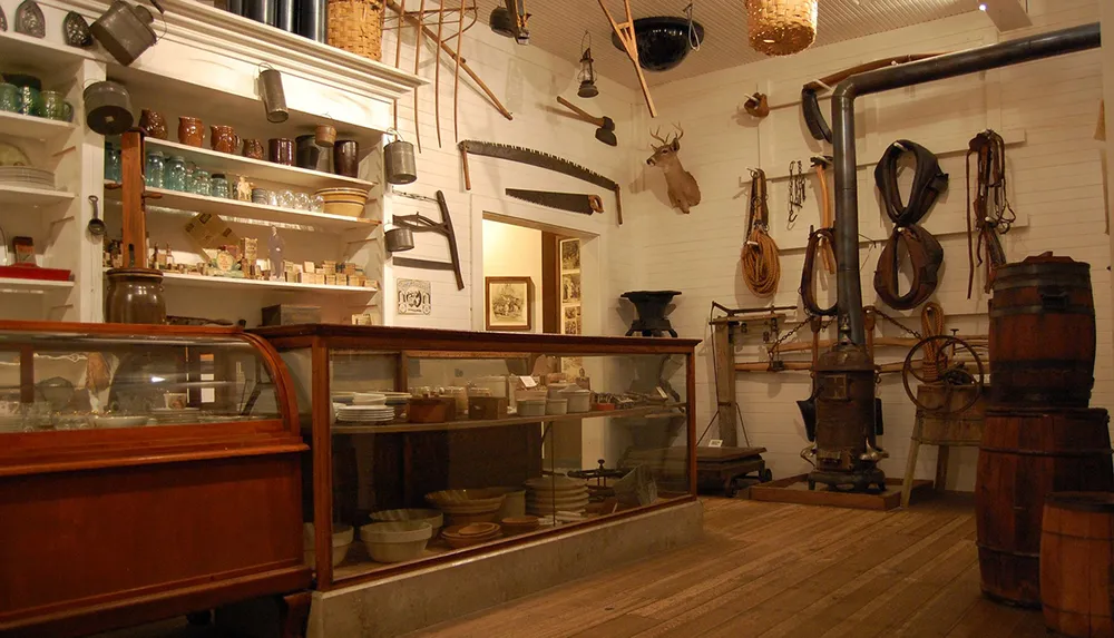 The image depicts a vintage general store interior with various antique items and kitchen implements on display contributing to a nostalgic atmosphere
