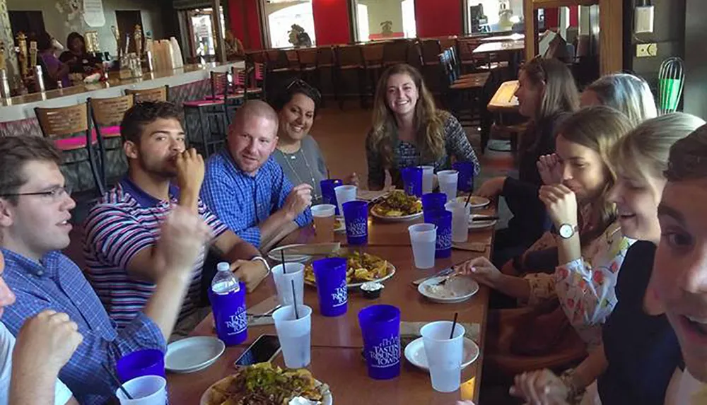 A group of people appears to be enjoying a lively meal together at a casual dining restaurant