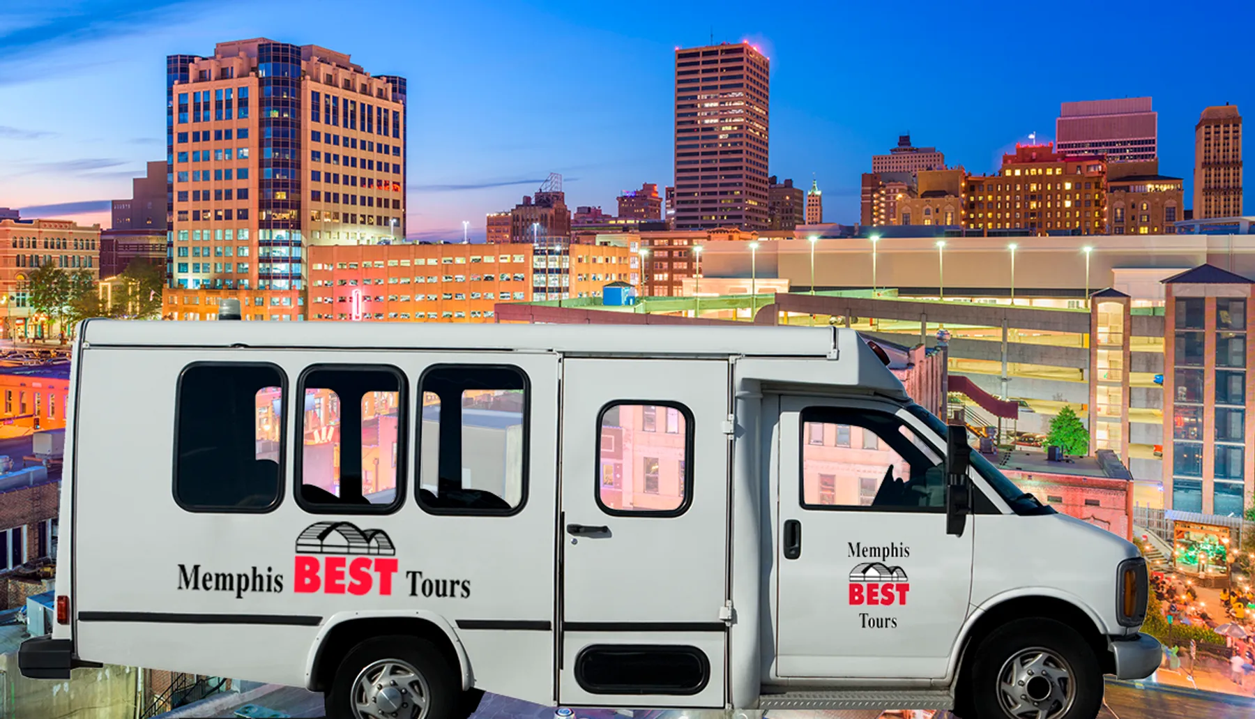 A tour van with Memphis BEST Tours on its side is parked with a backdrop of the Memphis skyline at twilight.